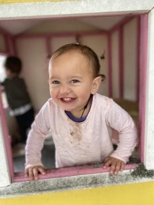 Infant playing with soft blocks