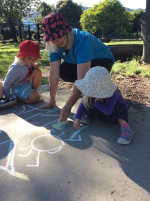 Toddler painting at a low table